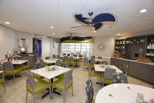 dining space featuring ceiling fan and light hardwood / wood-style floors