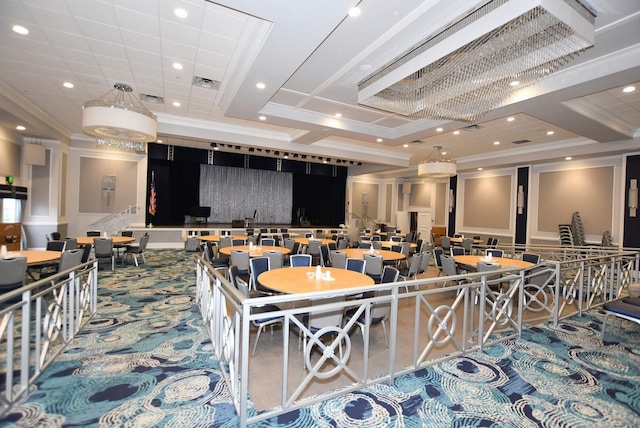 dining area with carpet, a raised ceiling, and ornamental molding