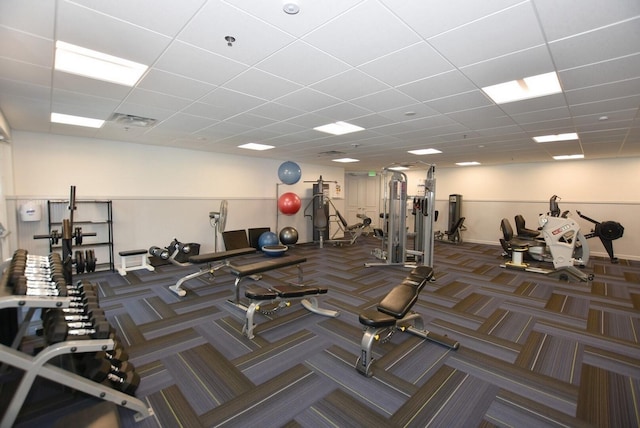 gym featuring a drop ceiling