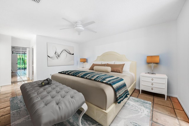 bedroom featuring access to outside, tile patterned floors, and ceiling fan