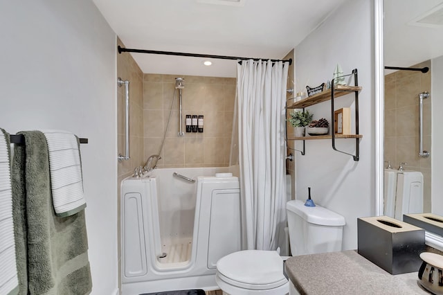 bathroom with shower / tub combo and toilet