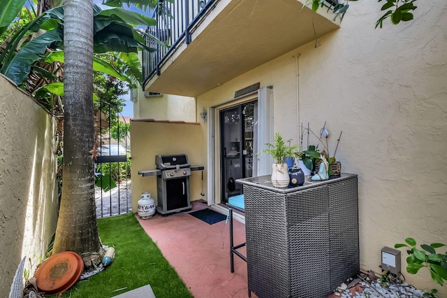 view of patio / terrace with a balcony and grilling area