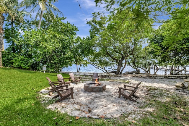 view of yard featuring an outdoor fire pit