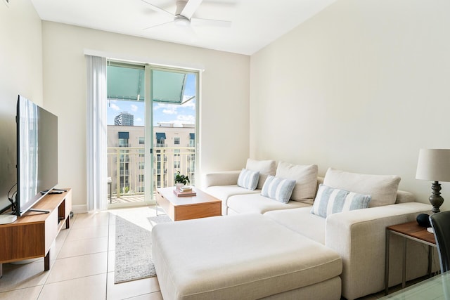 living room featuring light tile patterned floors and ceiling fan