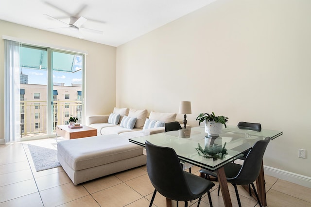 dining area with light tile patterned floors and ceiling fan