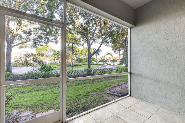 unfurnished sunroom featuring plenty of natural light