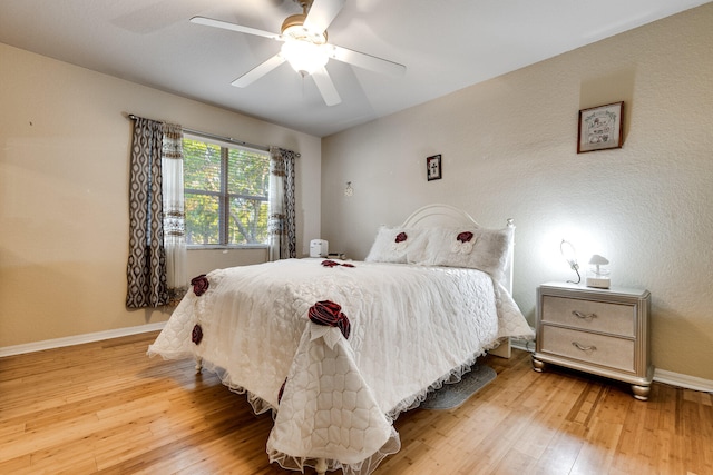 bedroom featuring light wood-type flooring and ceiling fan