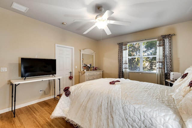 bedroom featuring ceiling fan and light hardwood / wood-style floors