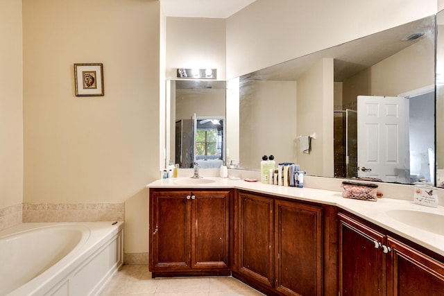 bathroom featuring vanity, separate shower and tub, and tile patterned floors