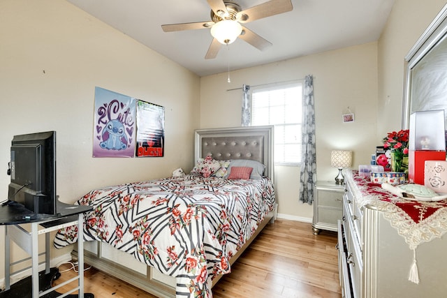 bedroom with ceiling fan and light hardwood / wood-style floors