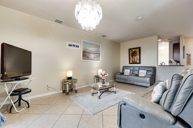 living room with light tile patterned floors and a notable chandelier