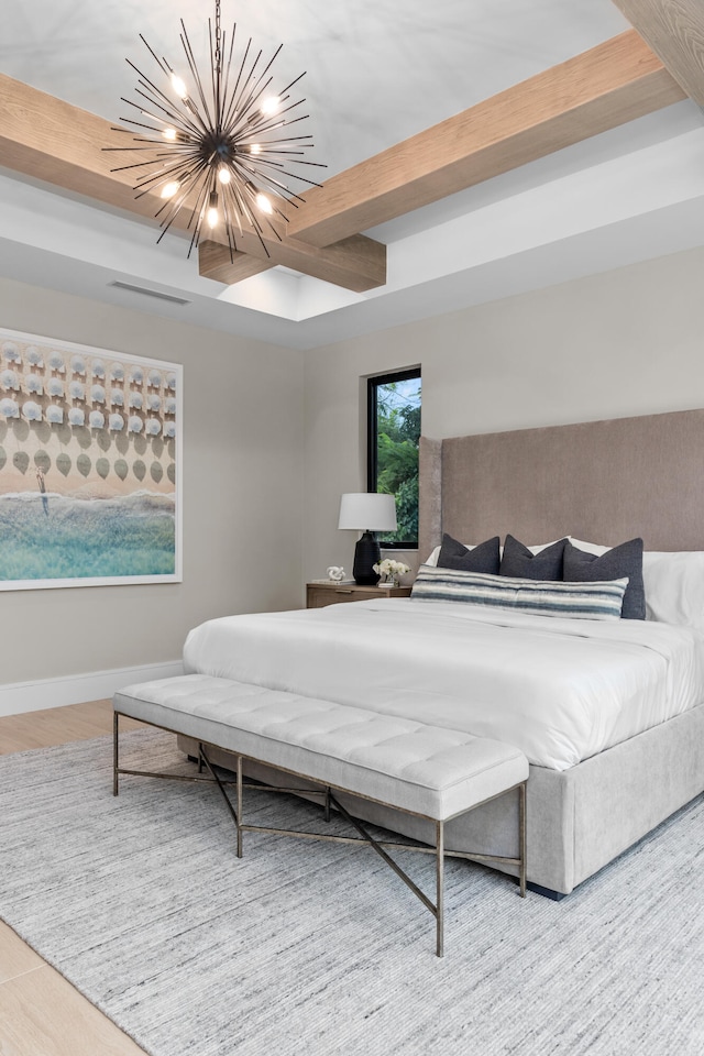 bedroom featuring beamed ceiling and a chandelier