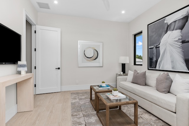 living room with light hardwood / wood-style flooring