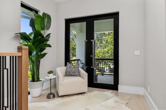 entryway featuring french doors and light hardwood / wood-style floors