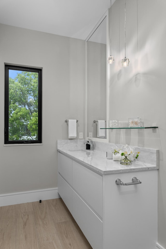 bathroom featuring vanity and hardwood / wood-style flooring