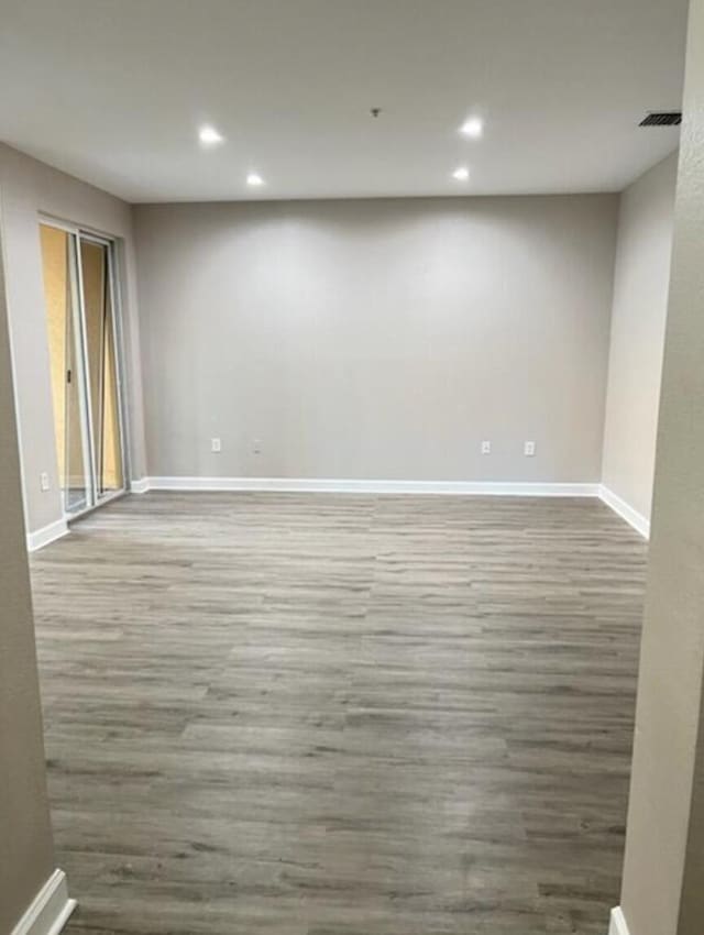 empty room featuring wood-type flooring