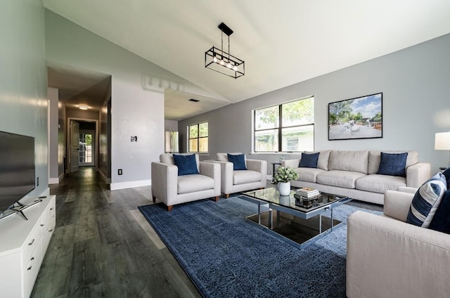 living room featuring dark wood-type flooring and lofted ceiling