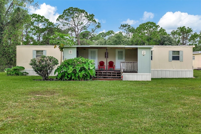 view of front of house featuring covered porch and a front lawn