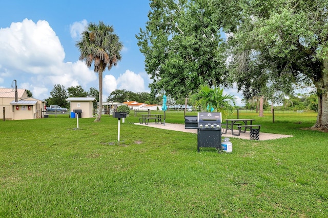 view of property's community with a yard