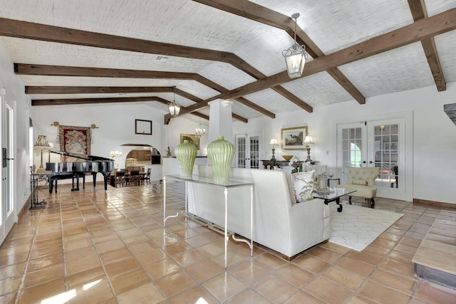 tiled living room featuring vaulted ceiling with beams and french doors