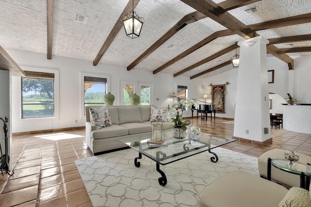 living room featuring french doors, light tile patterned flooring, and lofted ceiling with beams