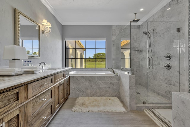 bathroom featuring plenty of natural light, wood-type flooring, and ornamental molding