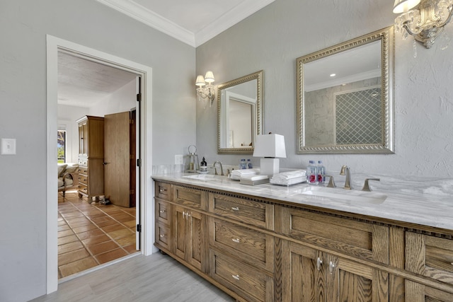 bathroom featuring hardwood / wood-style floors, vanity, and ornamental molding