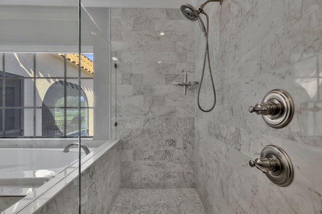 bathroom featuring tiled shower