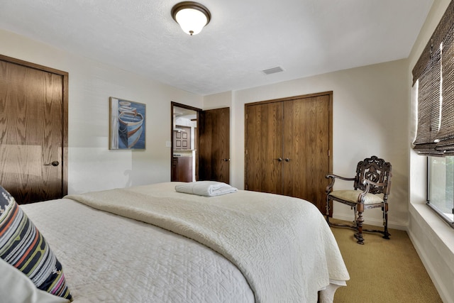 bedroom featuring light carpet