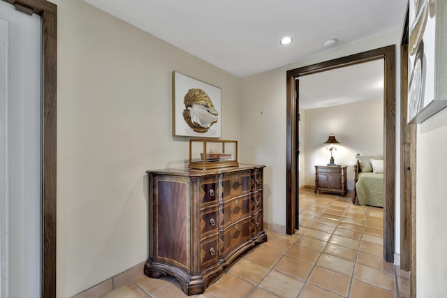 hall with light tile patterned flooring