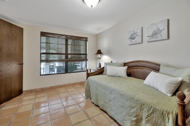 bedroom featuring light tile patterned floors