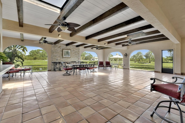 view of patio featuring ceiling fan