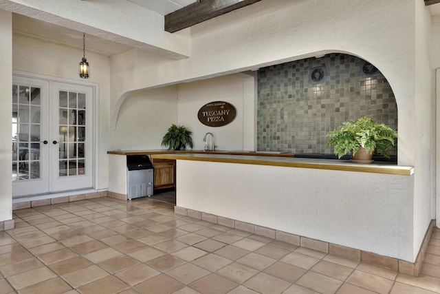 reception featuring french doors and sink