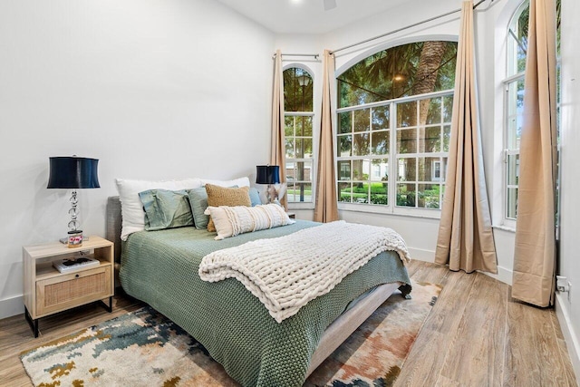 bedroom with hardwood / wood-style floors