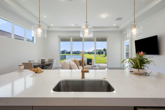 kitchen featuring pendant lighting and plenty of natural light