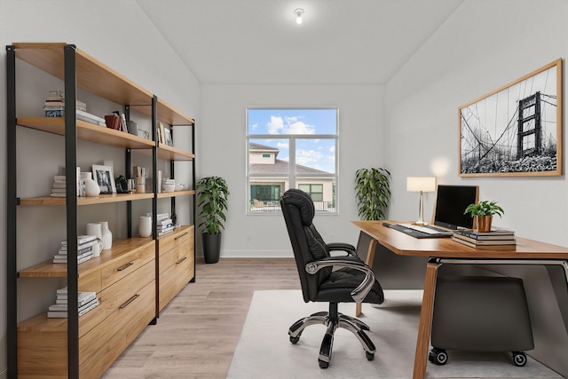 office area with light hardwood / wood-style flooring