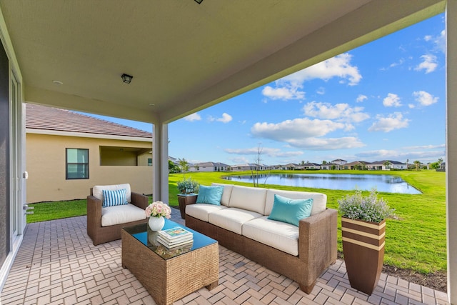 view of patio featuring an outdoor living space and a water view