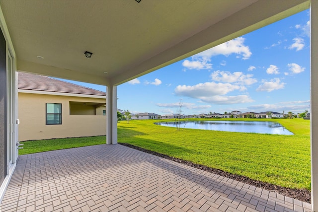 view of patio featuring a water view