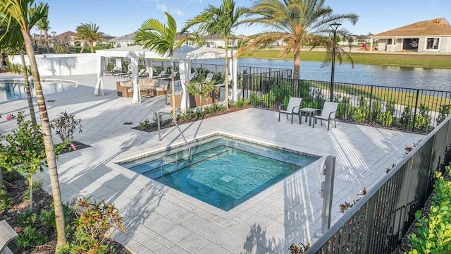 view of pool with a patio area, a community hot tub, and a water view