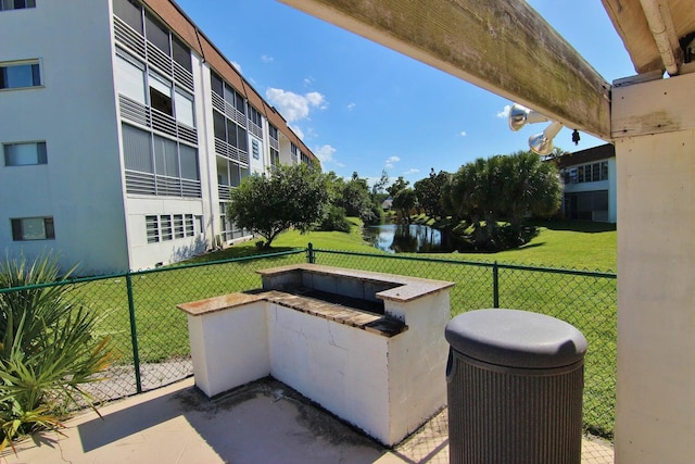 view of patio with a water view