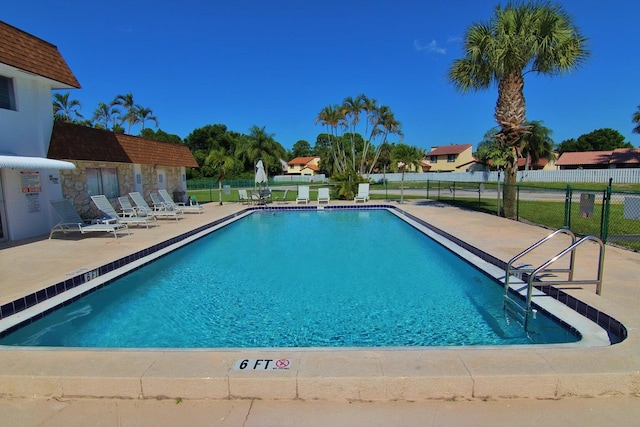 view of swimming pool featuring a patio area