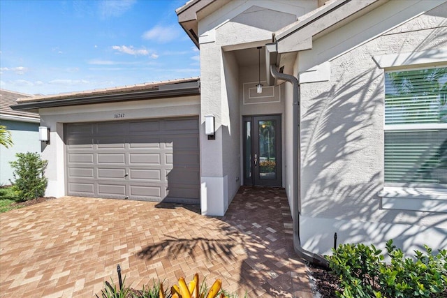 entrance to property featuring a garage