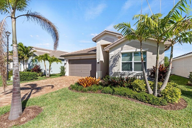 view of front of property featuring a garage and a front lawn