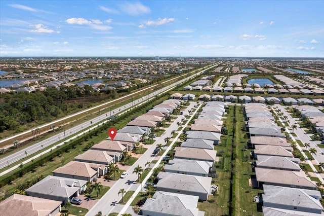 drone / aerial view with a water view