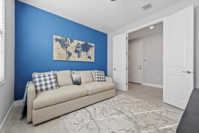 living room featuring a textured ceiling