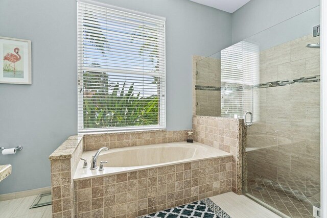 carpeted bedroom featuring connected bathroom, ceiling fan, and a textured ceiling