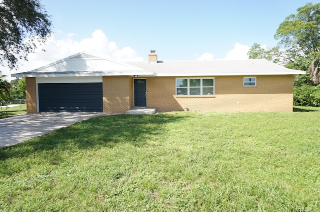 ranch-style home with a front lawn and a garage