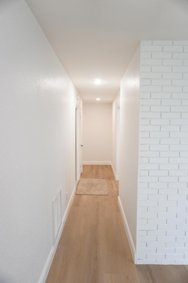 hall with light hardwood / wood-style floors