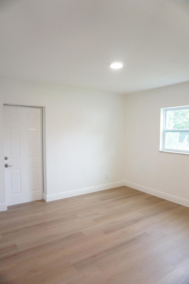 empty room with light wood-type flooring