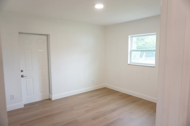 spare room with light hardwood / wood-style floors